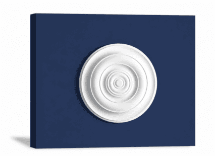 White decorative plaster ceiling medallion on navy blue background.