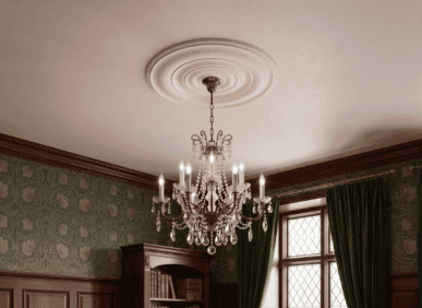 Chandelier with crystal details hanging from a decorative ceiling medallion in a traditional room.