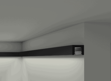 Modern interior with black coving featuring integrated LED lighting on a white ceiling and wall.