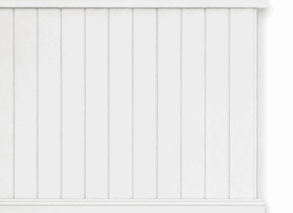 Decorative white MDF dado wall paneling with vertical grooves for UK interiors.