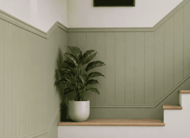 Decorative wall panelling with moulding in a traditional UK interior setting.